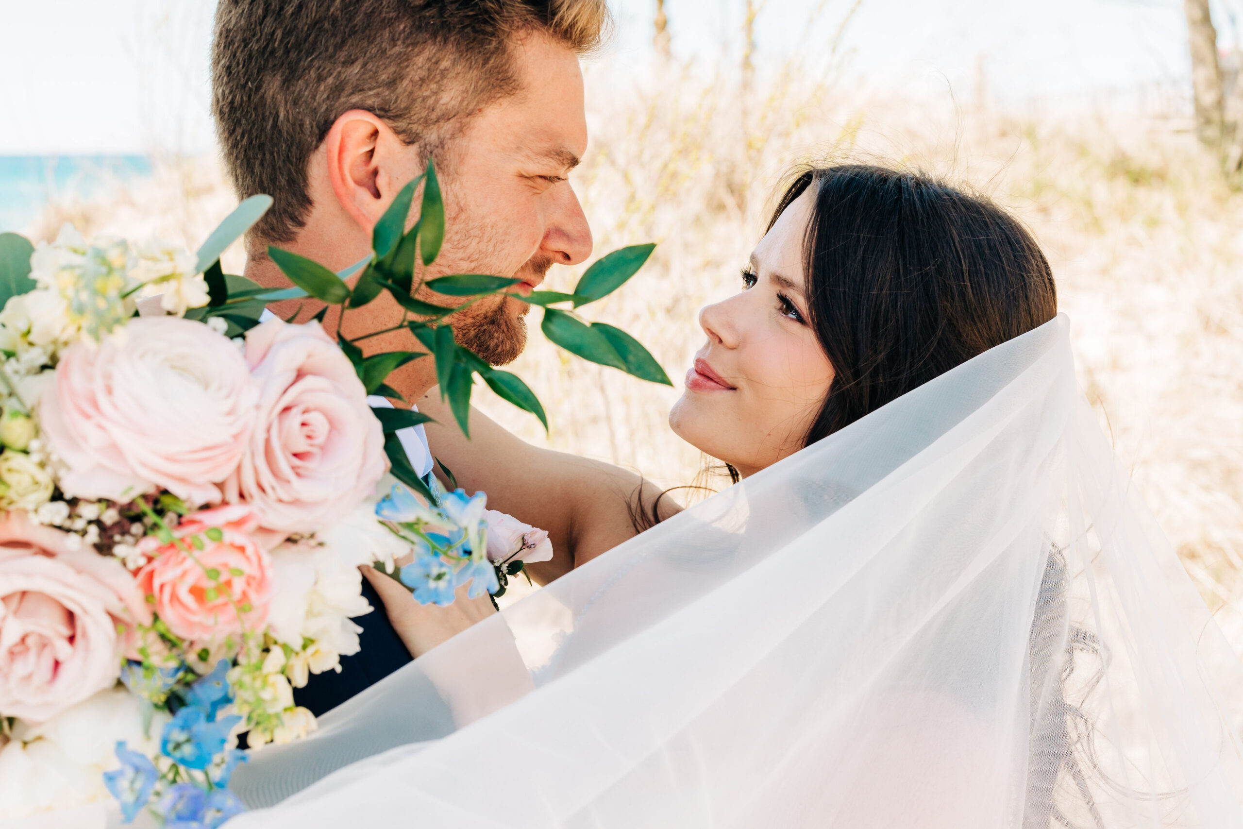 Couple embracing at wedding at Blue Bridge in Northern Michigan